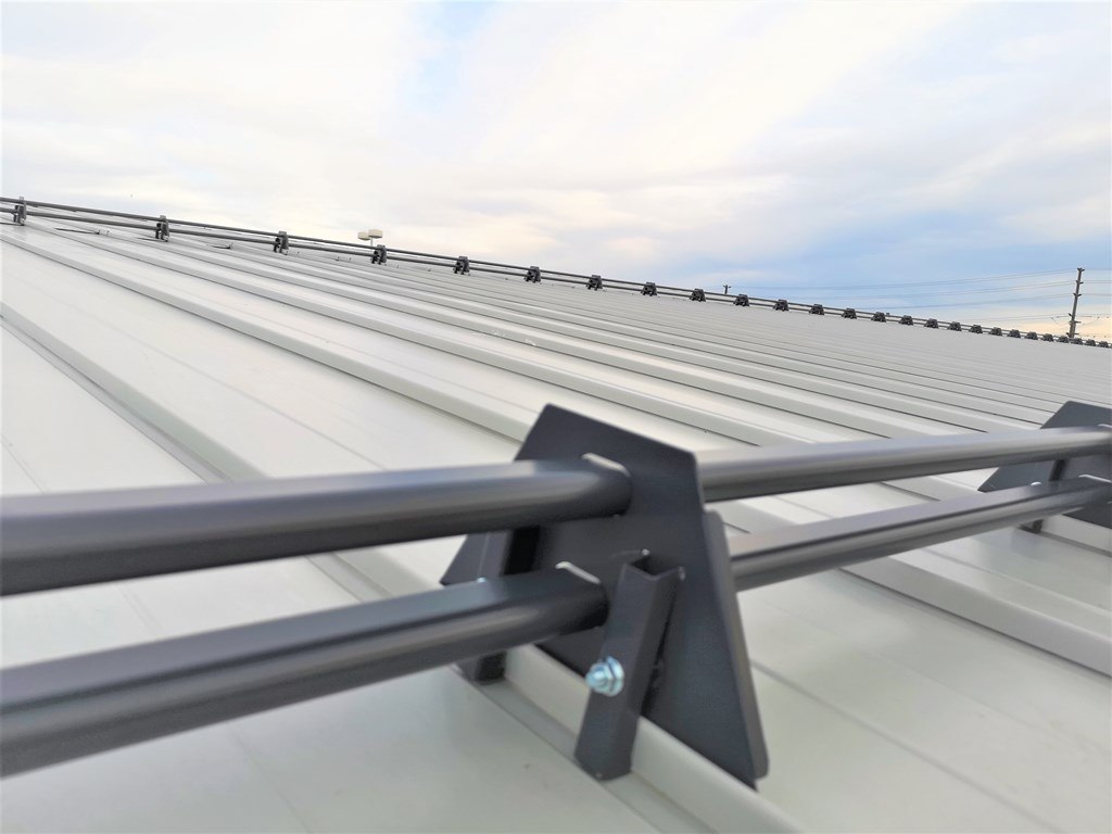 Snow guards for snap-lock standing seam metal roof