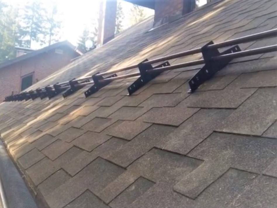 Snow guards on shingles roofs