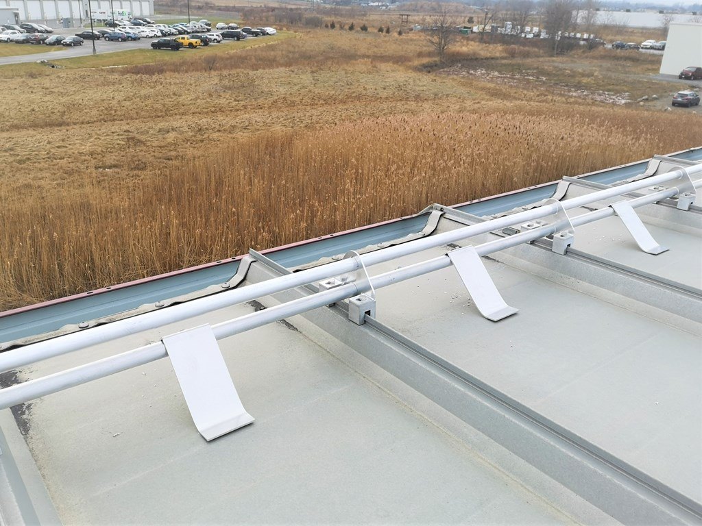 Aluminum tubular snowguards on metal roof