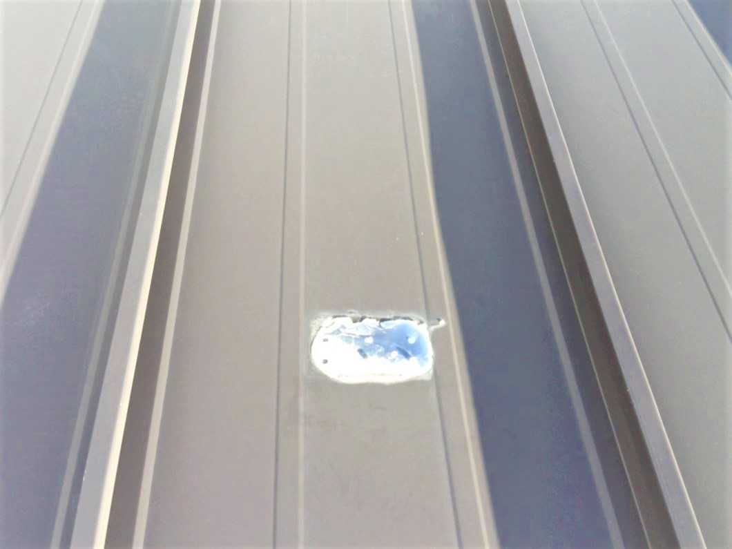 Broken plastic polycarbonate snow guards on metal roof