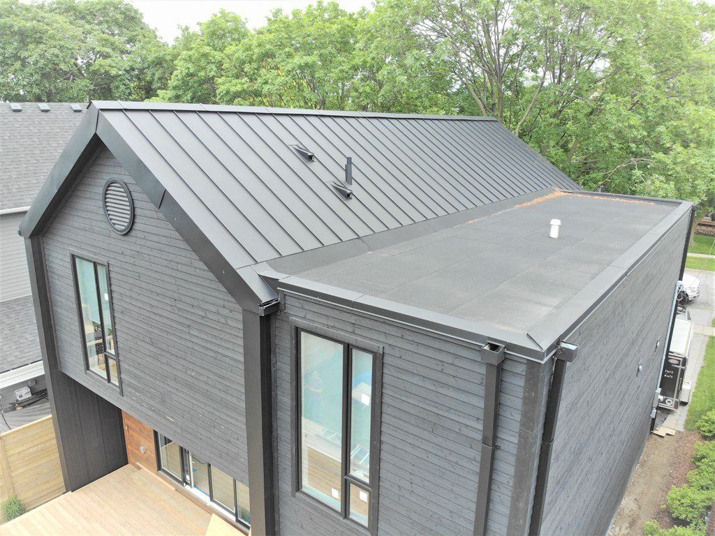 Flat roof project. Evans Ave. and Brown’s Line, Etobicoke. Metal Roof Experts in Ontario