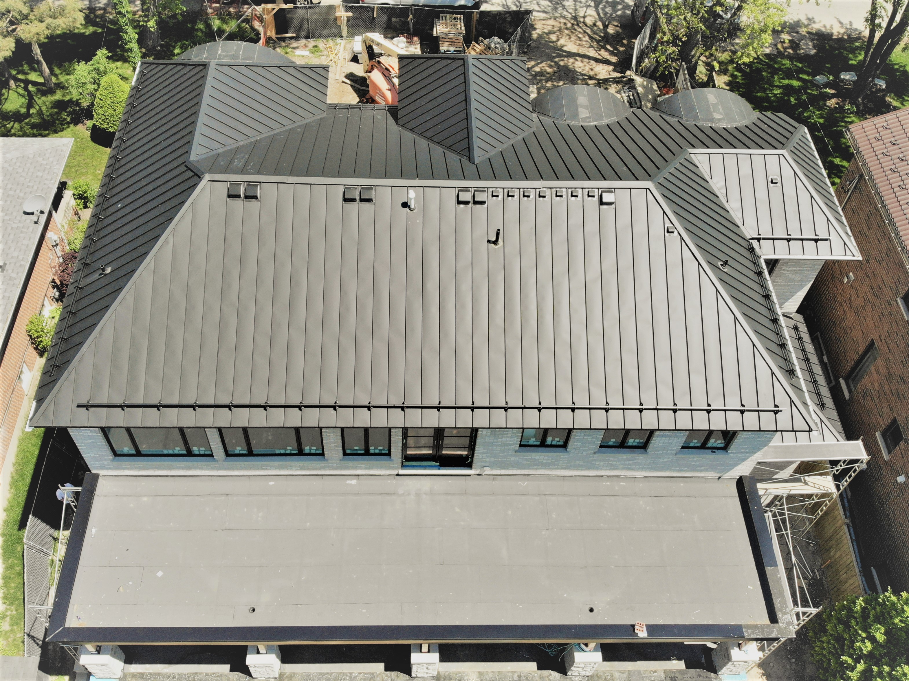 Standing seam metal roof, snow guards, flat roof