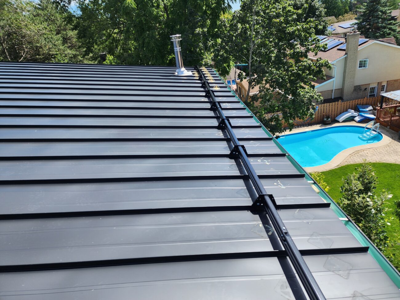 Snow guard clamp detail on standing seam roof, Aurora Ontario