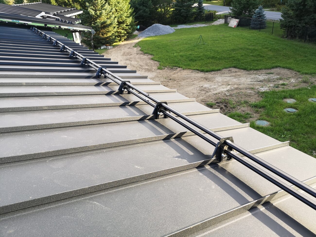 Standing seam metal roof with snow guards, residential project Barrie Ontario