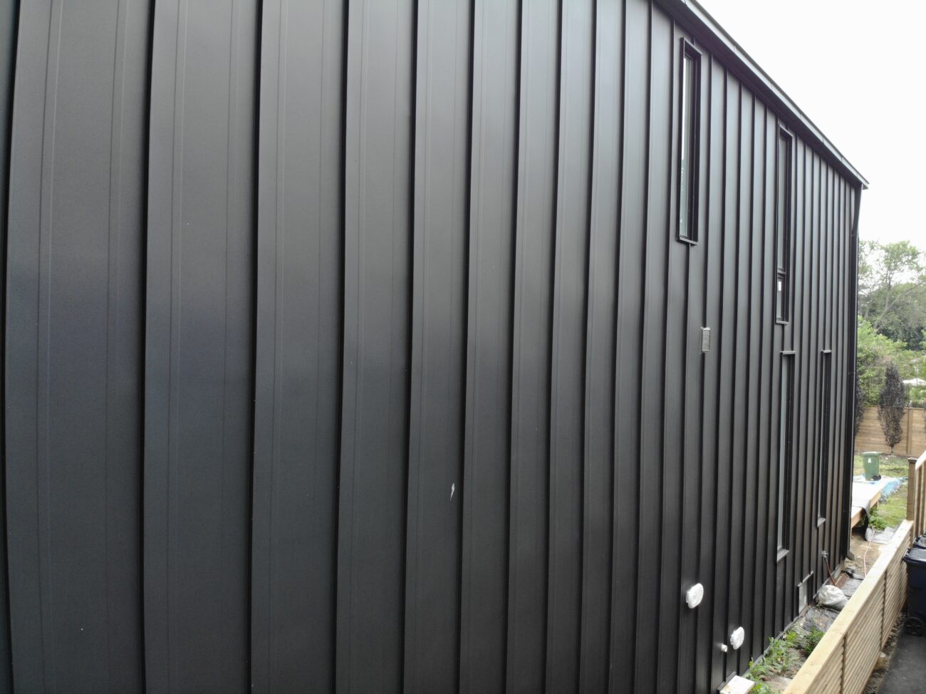 Standing seam metal wall cladding panels on residential exterior in Etobicoke, Toronto