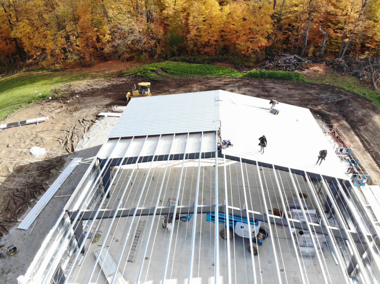 Metal roof panel installation on pre-engineered metal building, Caledon Ontario