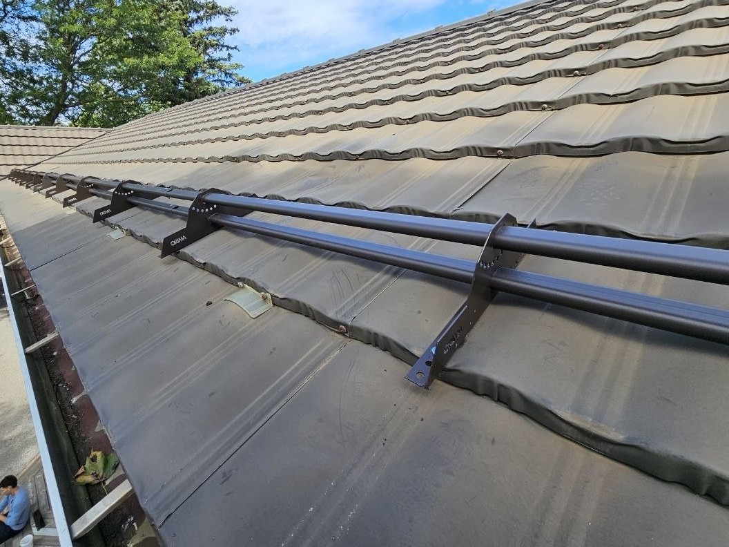 ORIMA LE3 bracket detail on metal tile roof, continuous tubular snow retention, Uxbridge