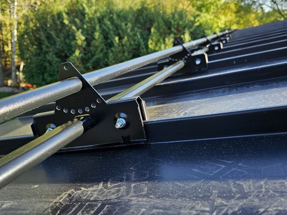 ORIMA LE2 snow guard clamp close-up on black standing seam roof, King City Ontario