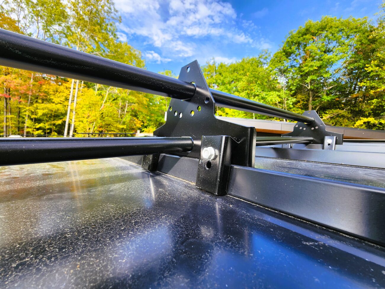 ORIMA LE2SL snow guards on black snap-lock standing seam roof, Muskoka Ontario — two rows