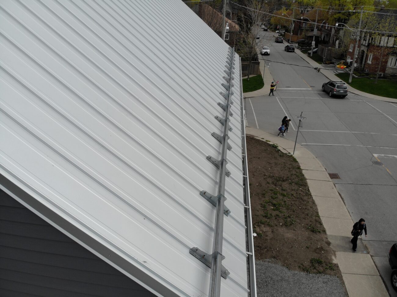 Snow guard clamp detail on Galvalume standing seam roof, North York Toronto