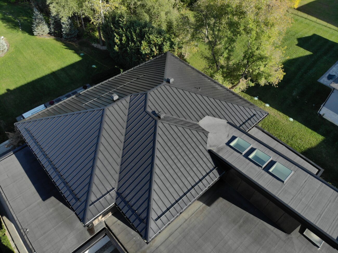 Mechanical lock standing seam metal roof in black, King City Ontario residential property