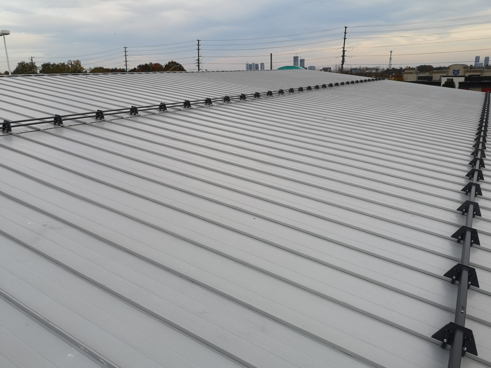 Commercial snap-lock standing seam roof above flat roof with HVAC equipment, Vaughan Ontario